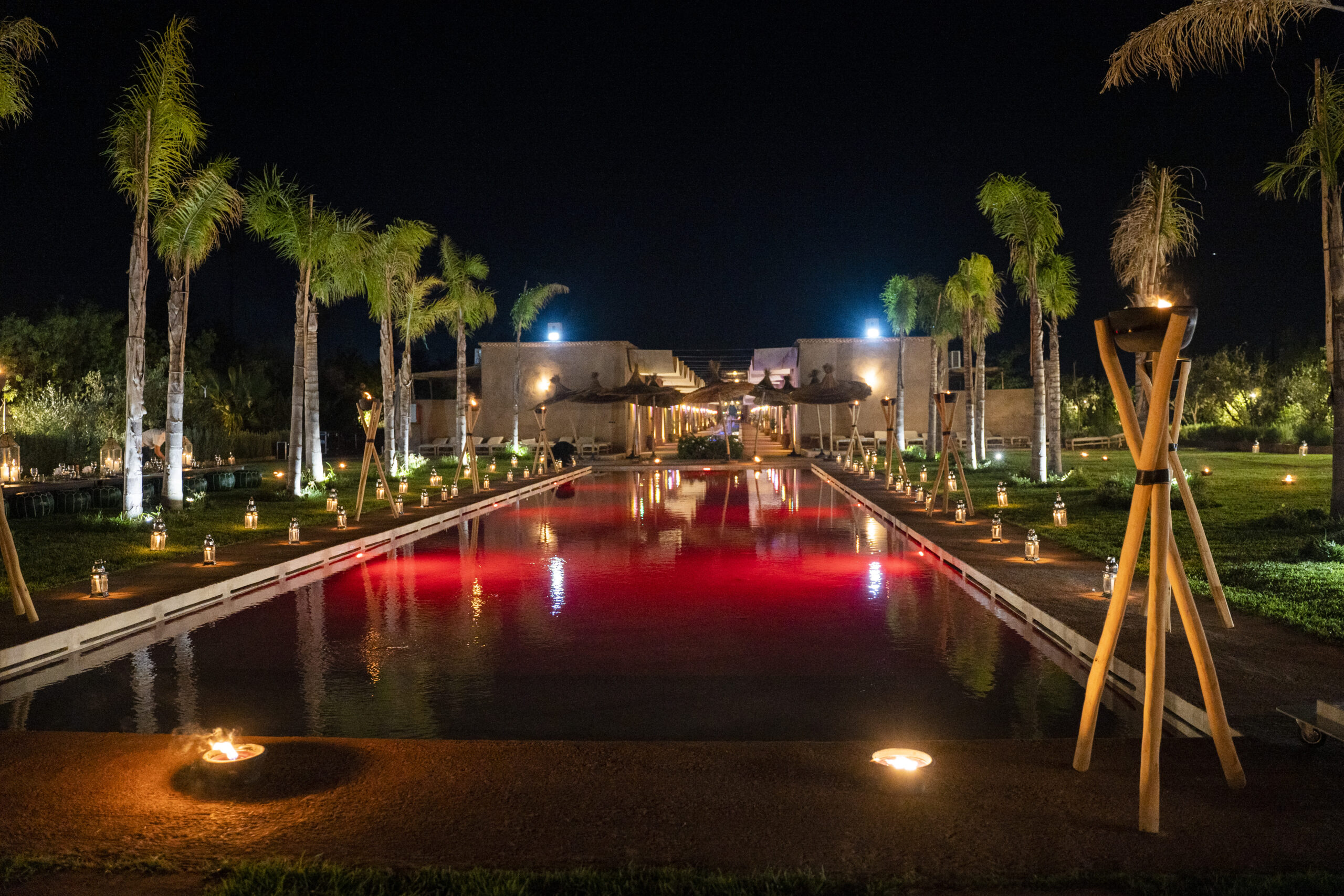 Al Destino Resort pool and palm grove at golden hour